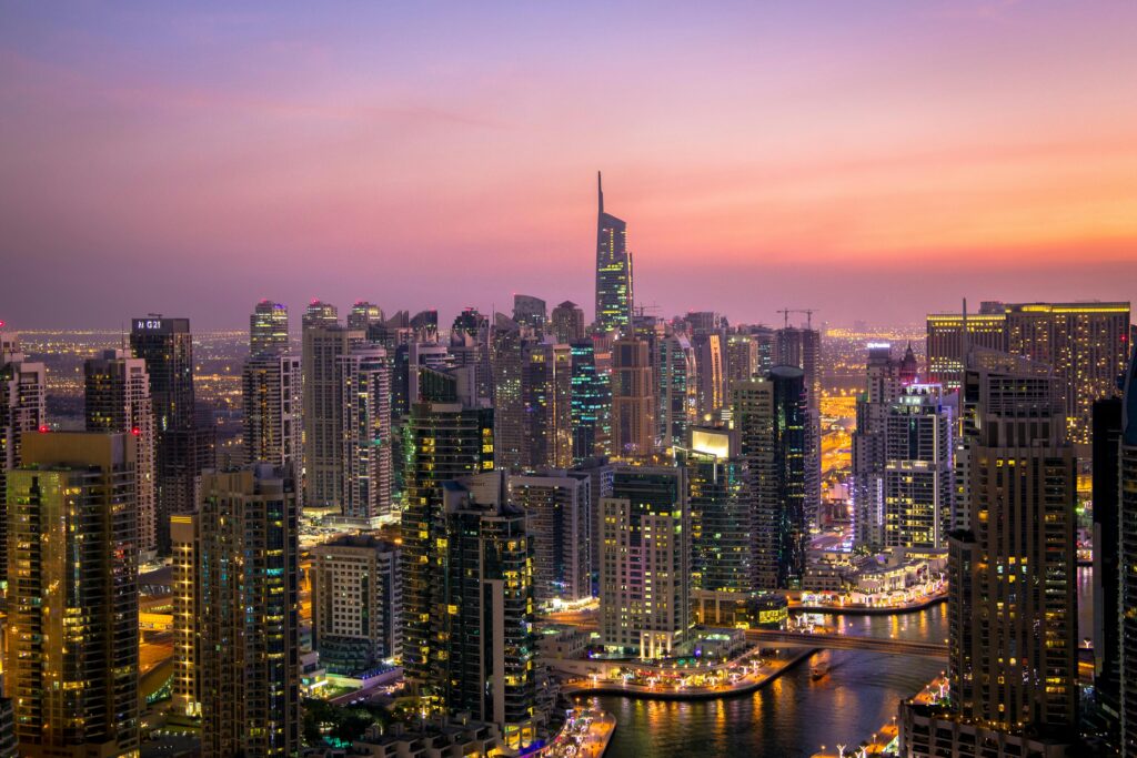 pexels-photo-325193-325193 Captivating view of Dubai's skyline at dusk with vibrant city lights and skyscrapers.